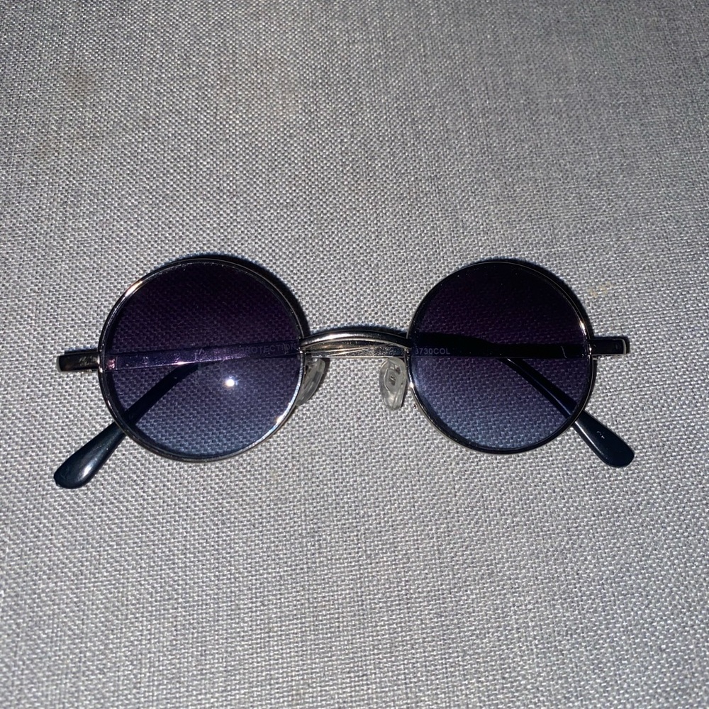 Small circled glasses with blue tint